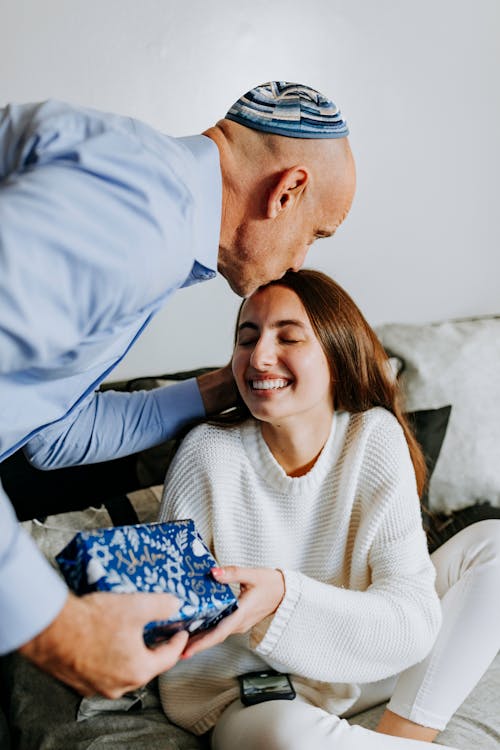 Free Photo Of Father Kissing The Forehead Of His Daughter Stock Photo