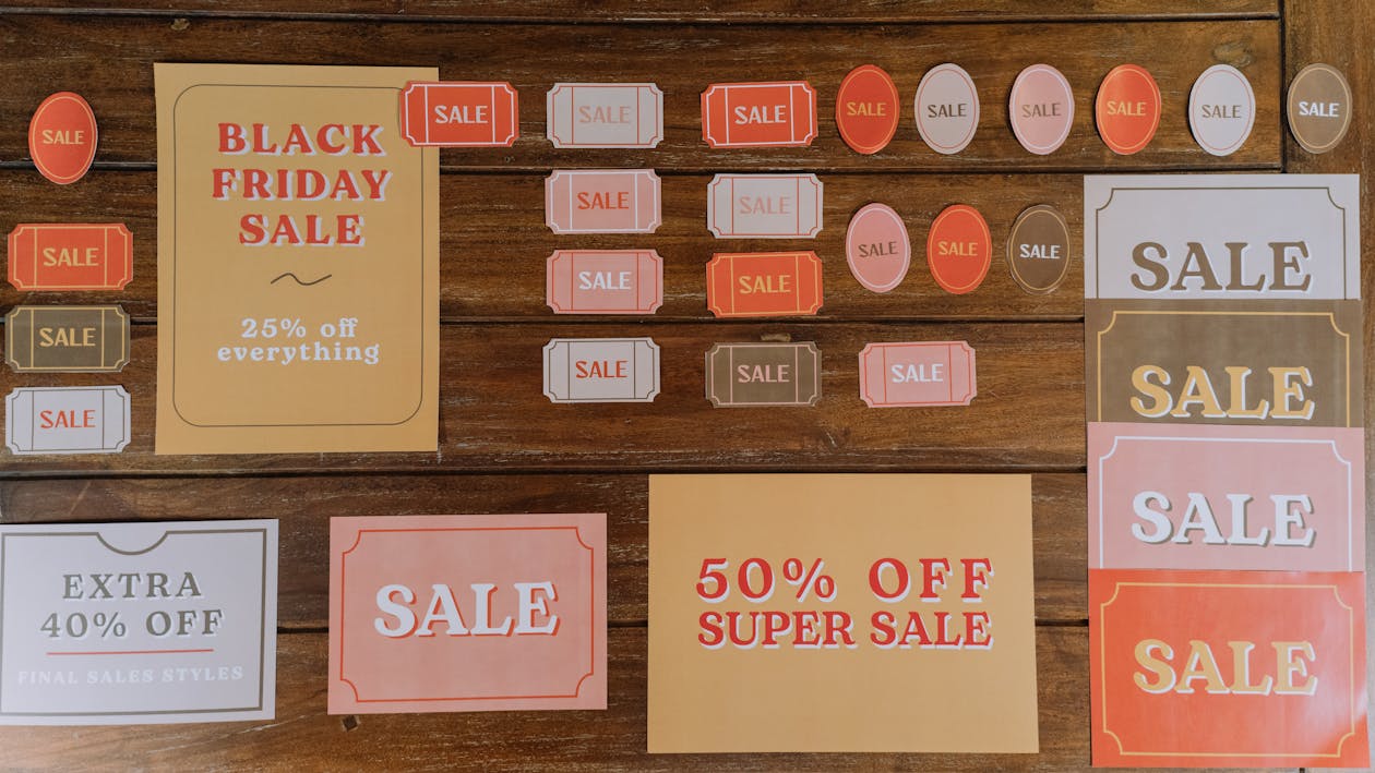 Sale Signs for Black Friday Sale on a Wooden Surface
