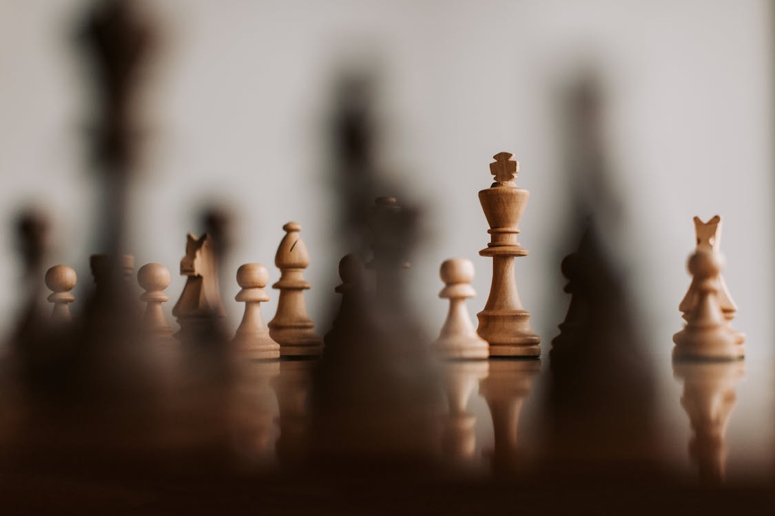 Compass Leaning Against Chess Piece With Other Chess Pieces In Background  Stock Photo - Download Image Now - iStock