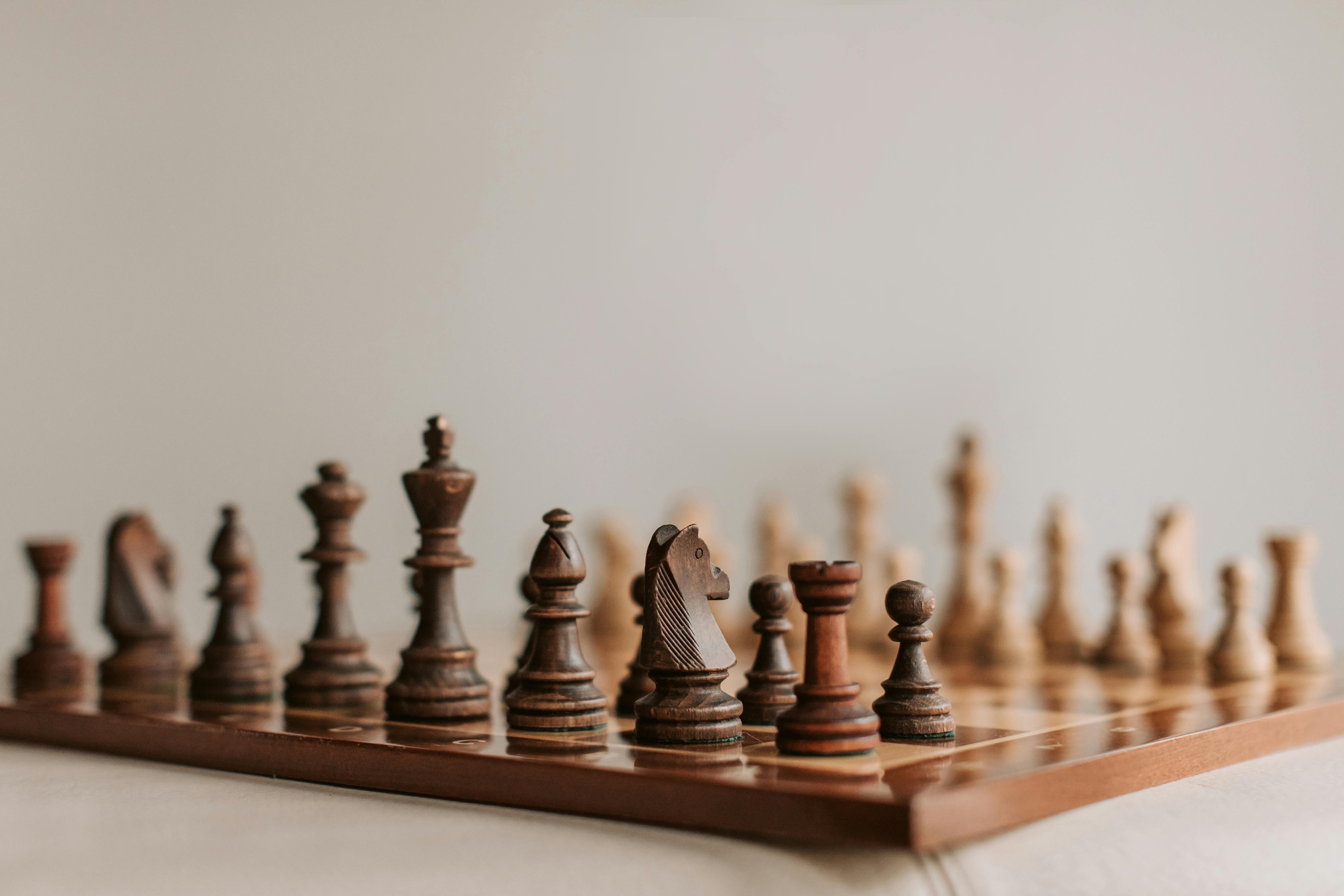 brown chess board with figures on a wooden table in a cafe, playing chess  Stock Photo - Alamy