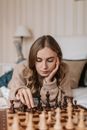 Woman in Beige Sweater Sitting on Couch