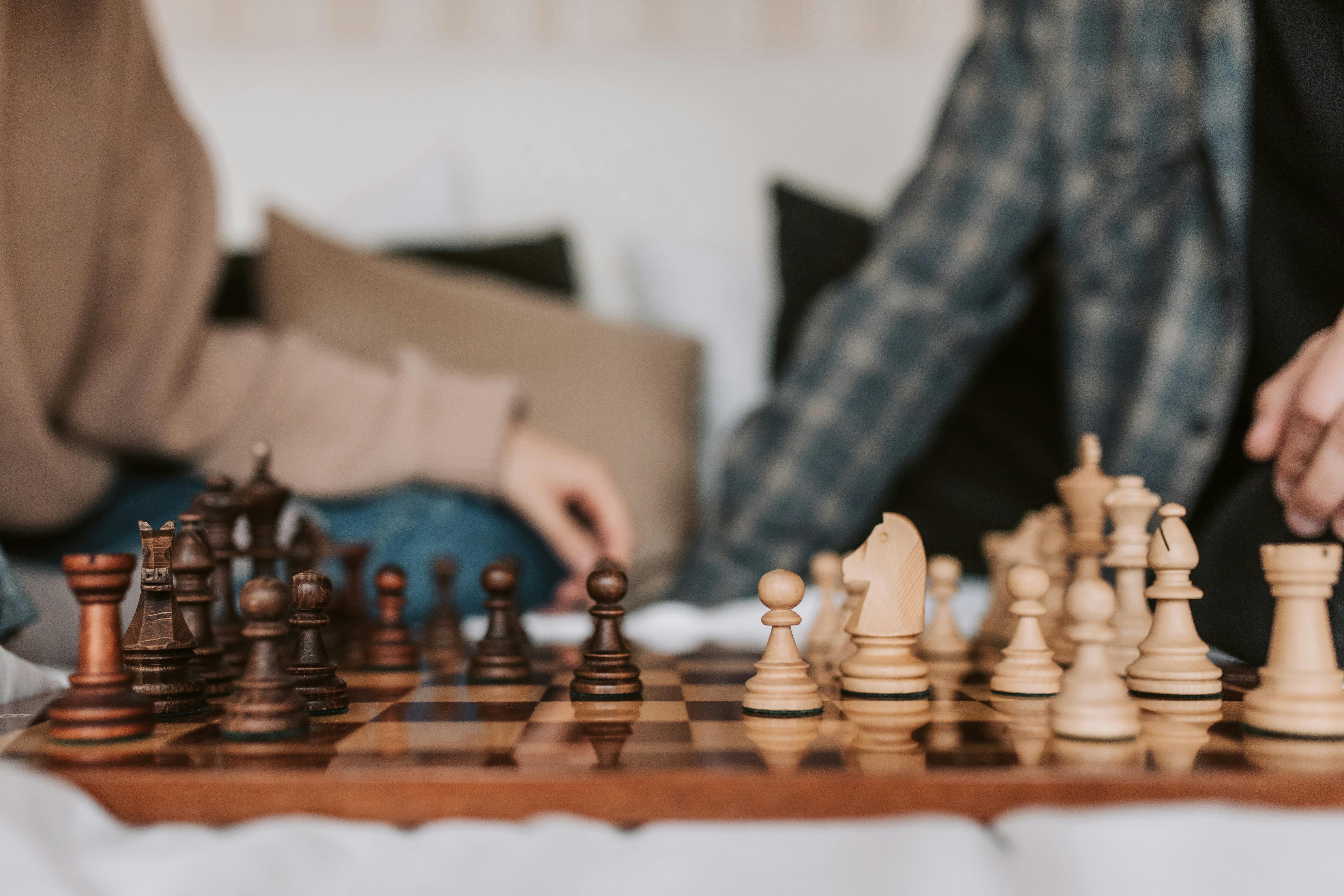 people playing a chess game