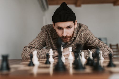 A Man Looking at the Chessboard Thinking His Move