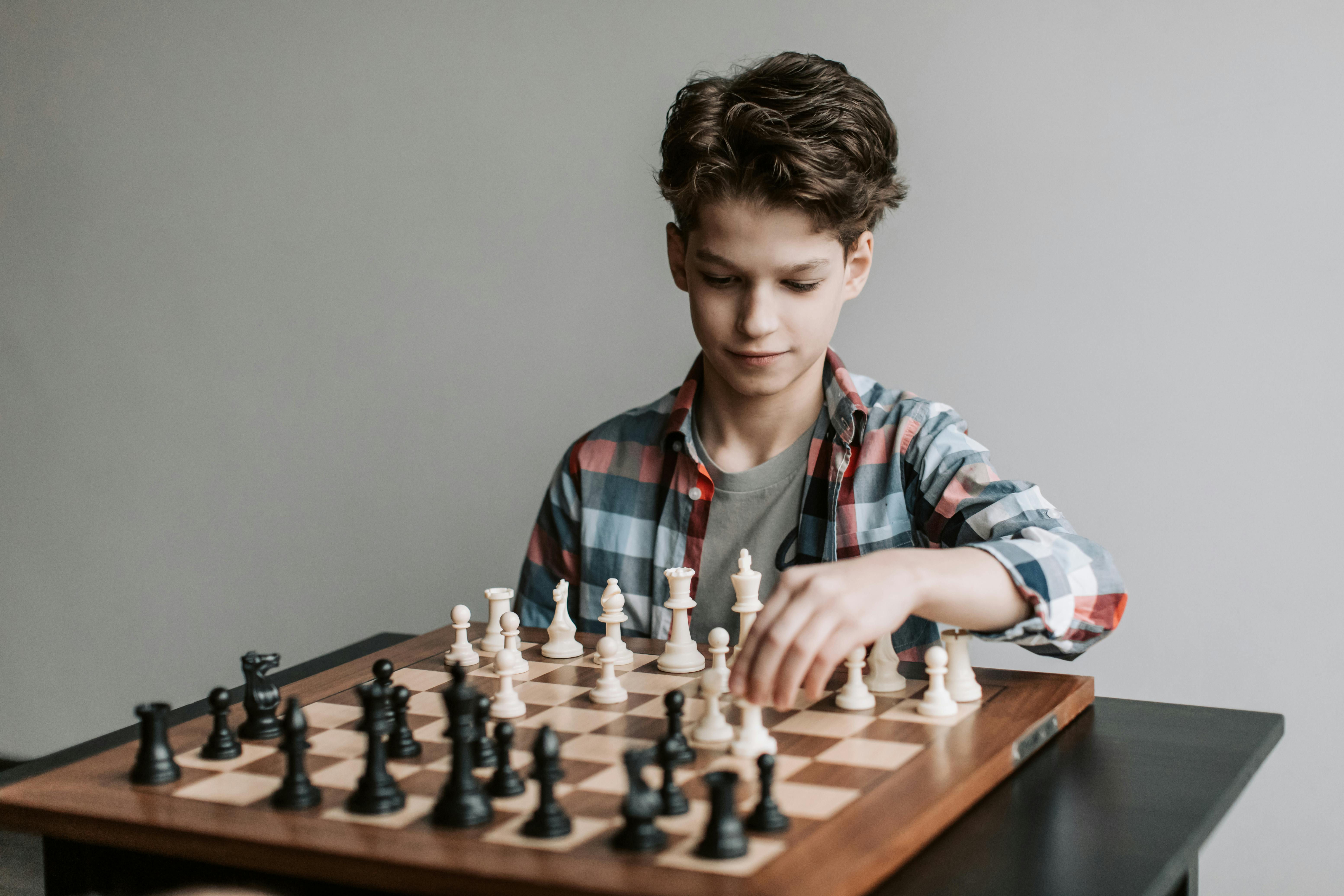 Little Clever Boy Playing Chess Online At Home Stock Photo, Picture and  Royalty Free Image. Image 47800282.