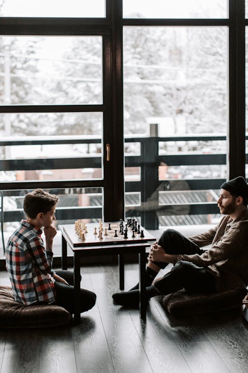 A Father and Son Playing a Game of Chess