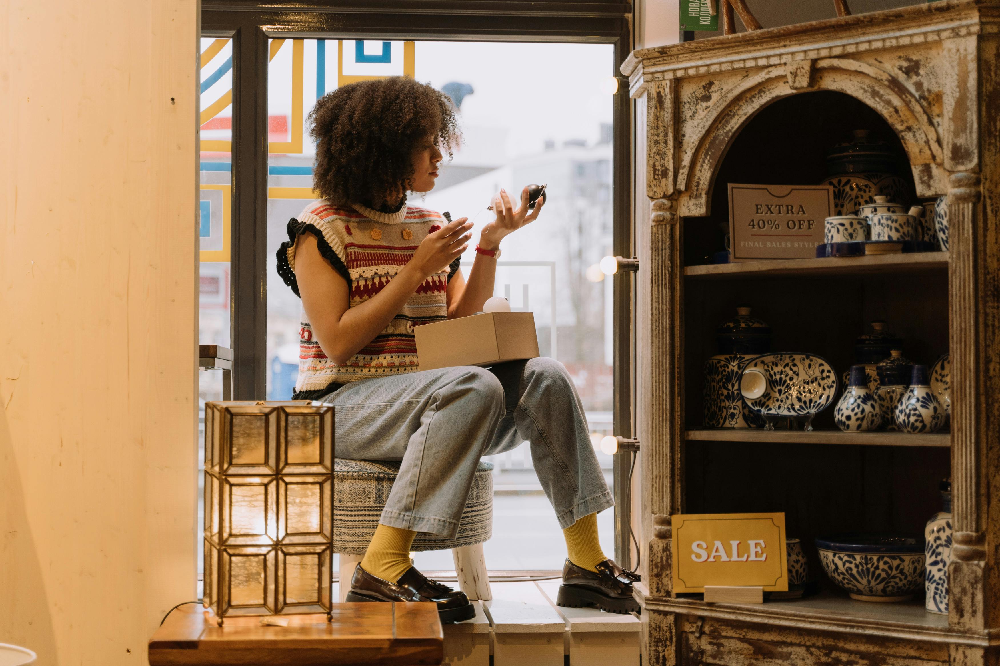 a woman checking on items on sale in the store