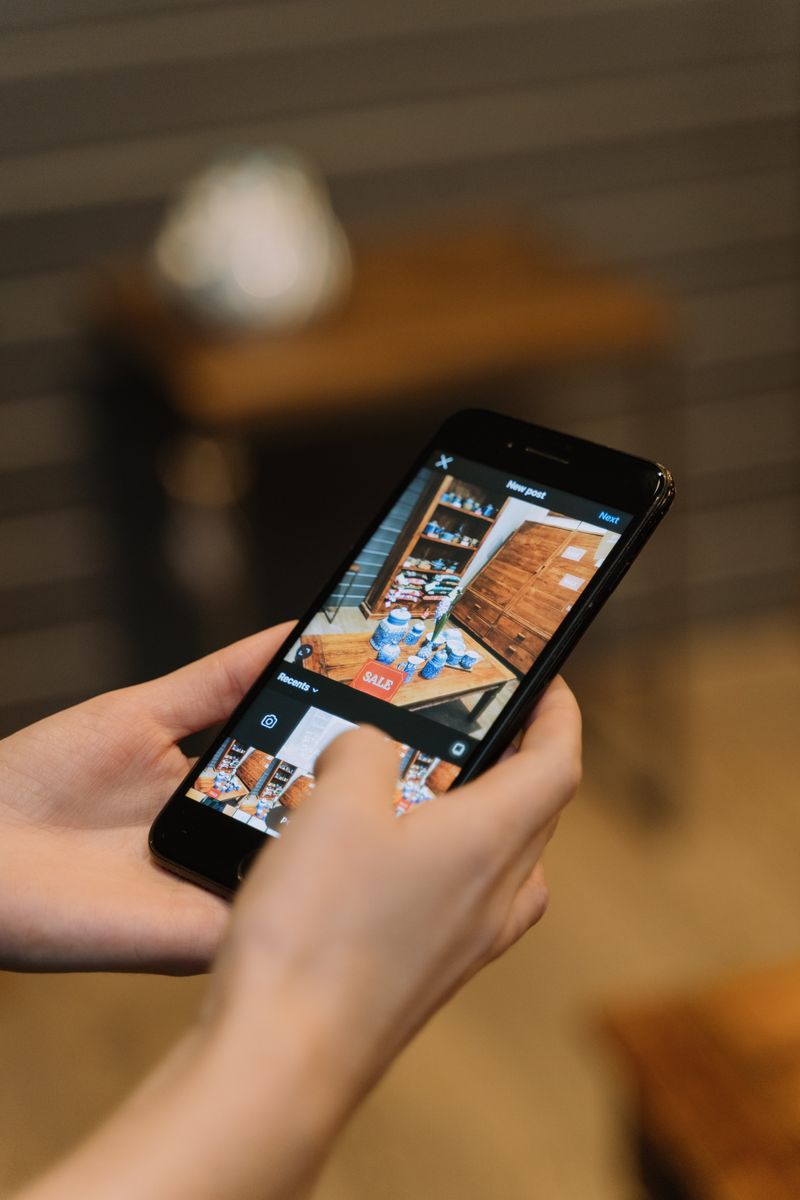 Smartphone photographing a product display in a shop