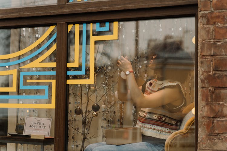 Woman Decorating Store Display