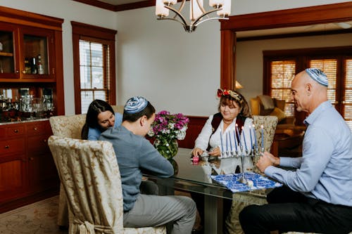 Photo Of Family Playing Dreidel Together