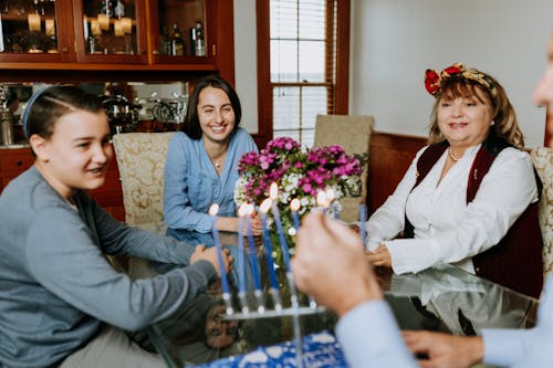 Photo Of Family Gathered Together In The Dining Area