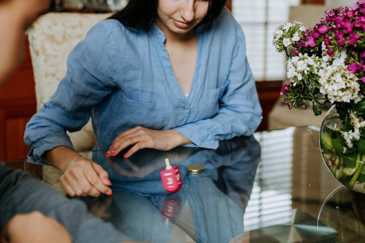 Photo Of Woman Playing Dreidel