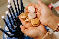 Photo Of Person Holding Gold Round Coins