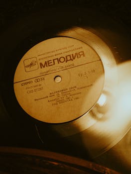 Close-up of a vintage Soviet vinyl record with Melodiya label and warm tones.