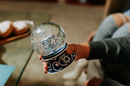 Photo Of Person Holding A Snow Ball 