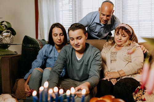 Photo Of Family Gathered In The Living Room 