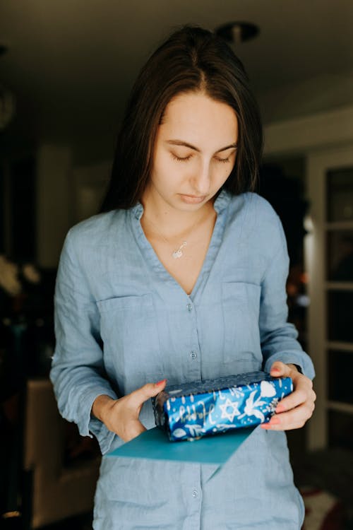 Free Photo Of Woman Holding A Present Stock Photo