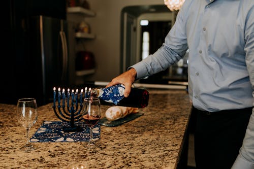 Photo Of Person Pouring Wine To The Glass