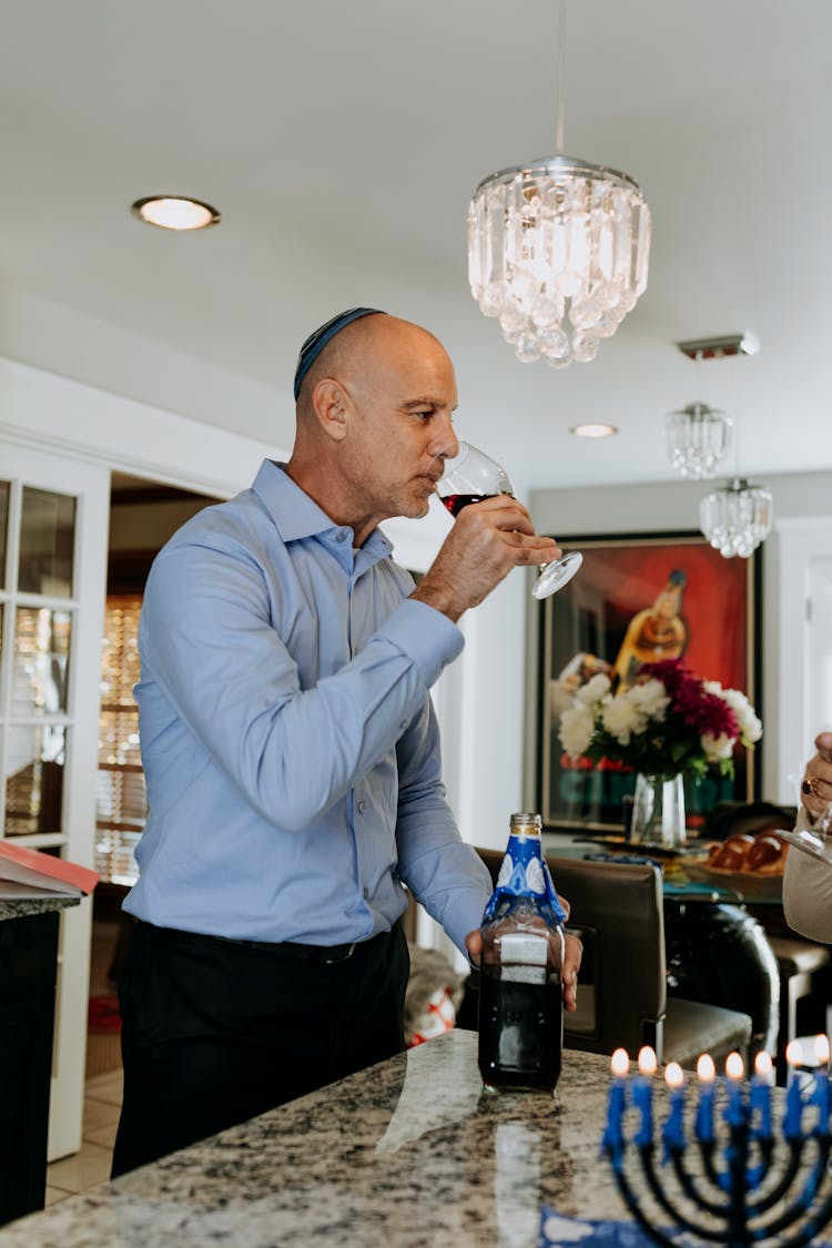 Photo Of Man Drinking His Wine 