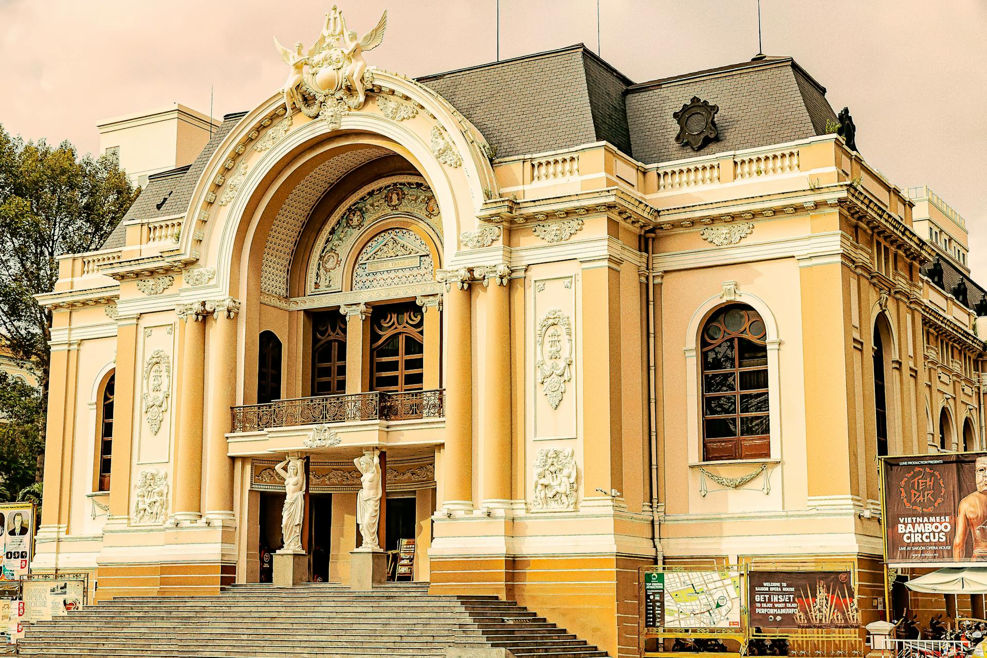 The elegant facade of the Saigon Opera House in Ho Chi Minh City under a clear sky.