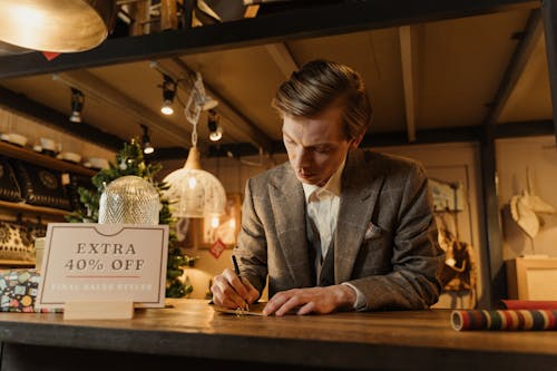 Man in a Suit Working at a Store