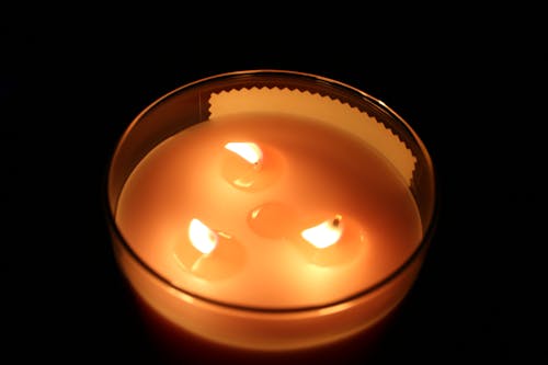 Free A Candle in a Glass Container Stock Photo