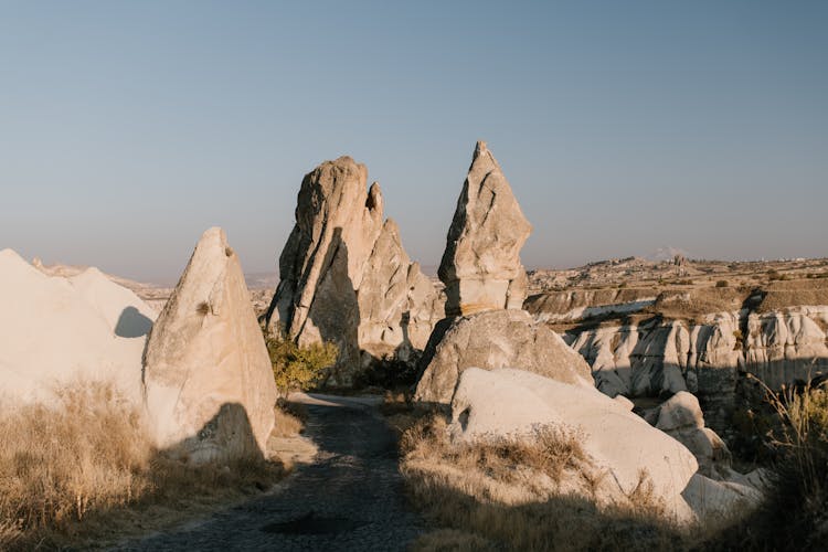 Old Road Between Sharp Rocks In Desert