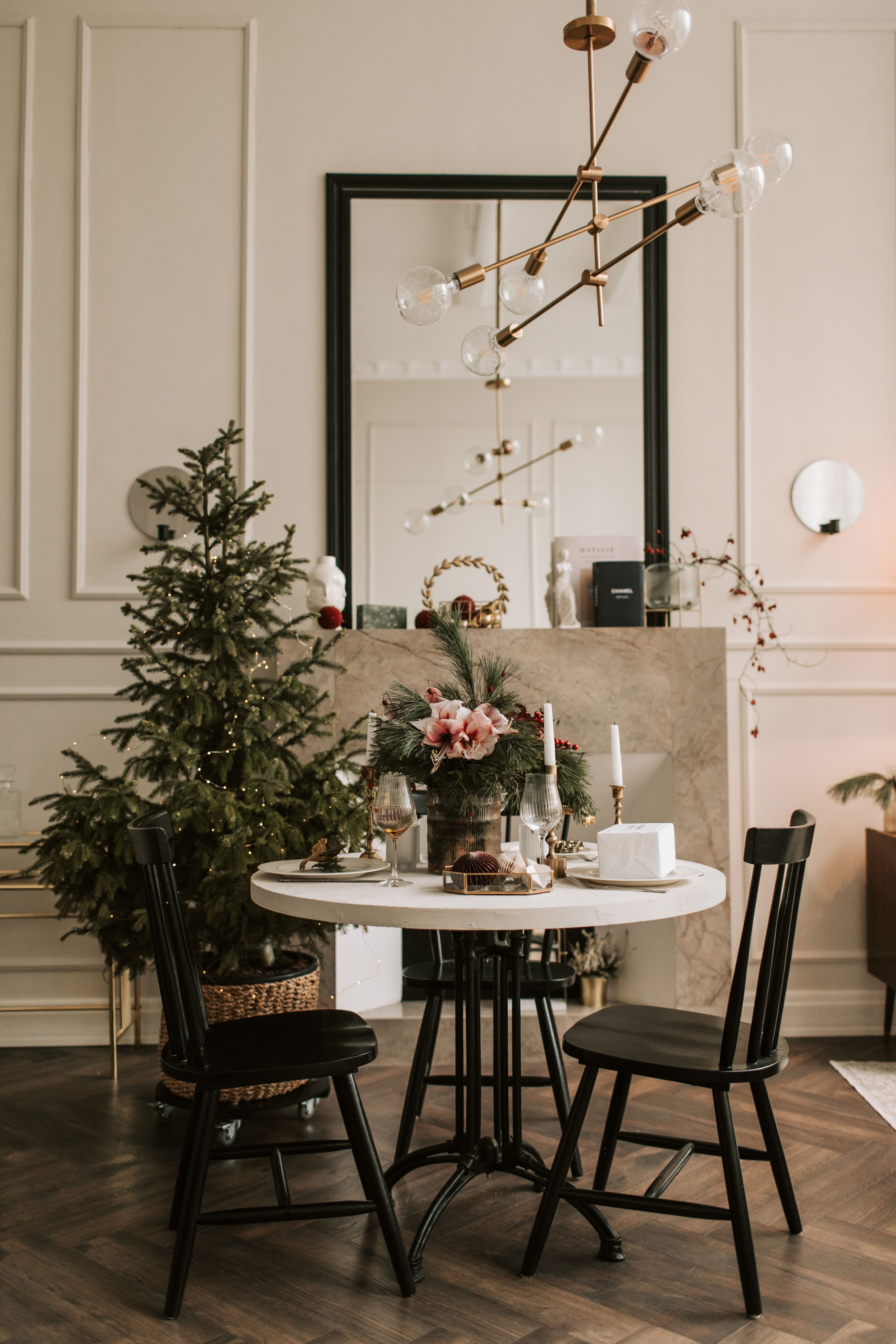 Warm and inviting Christmas-themed dining area with elegant decorations.