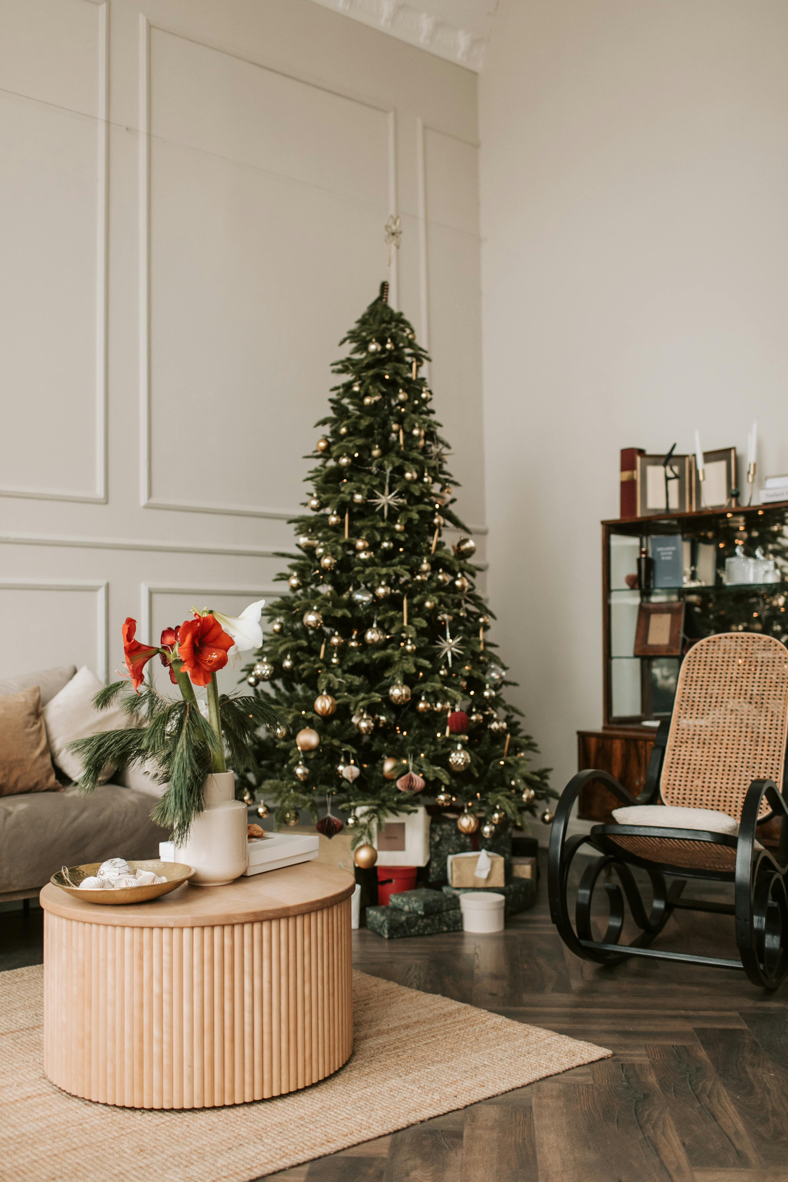 green christmas tree with baubles and gift boxes