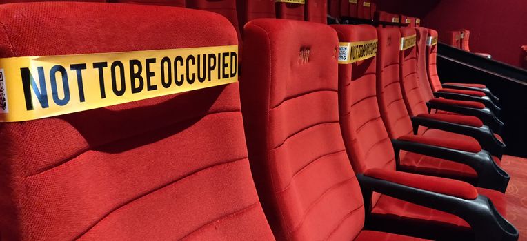 Red and Yellow Chair Near Red Sofa