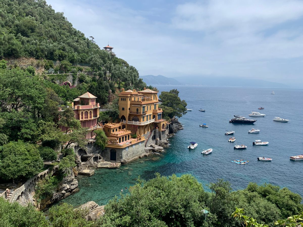 A villa on the Ligurian coast with boats moored below