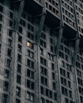 Striking view of brutalist architecture in Milan with a glowing window.. striking, view, brutalist