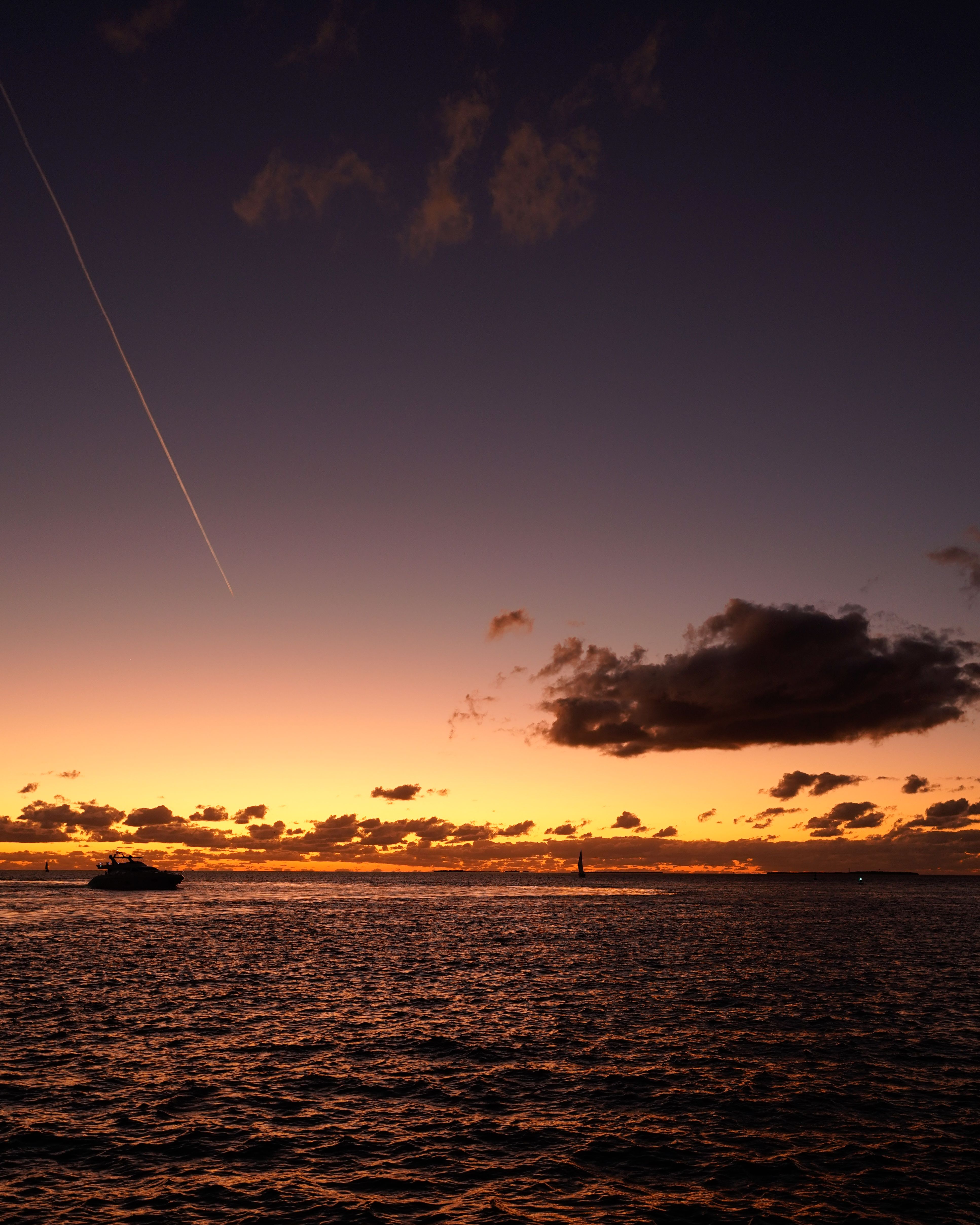 Silhouette of Motorboat on Body of Water · Free Stock Photo