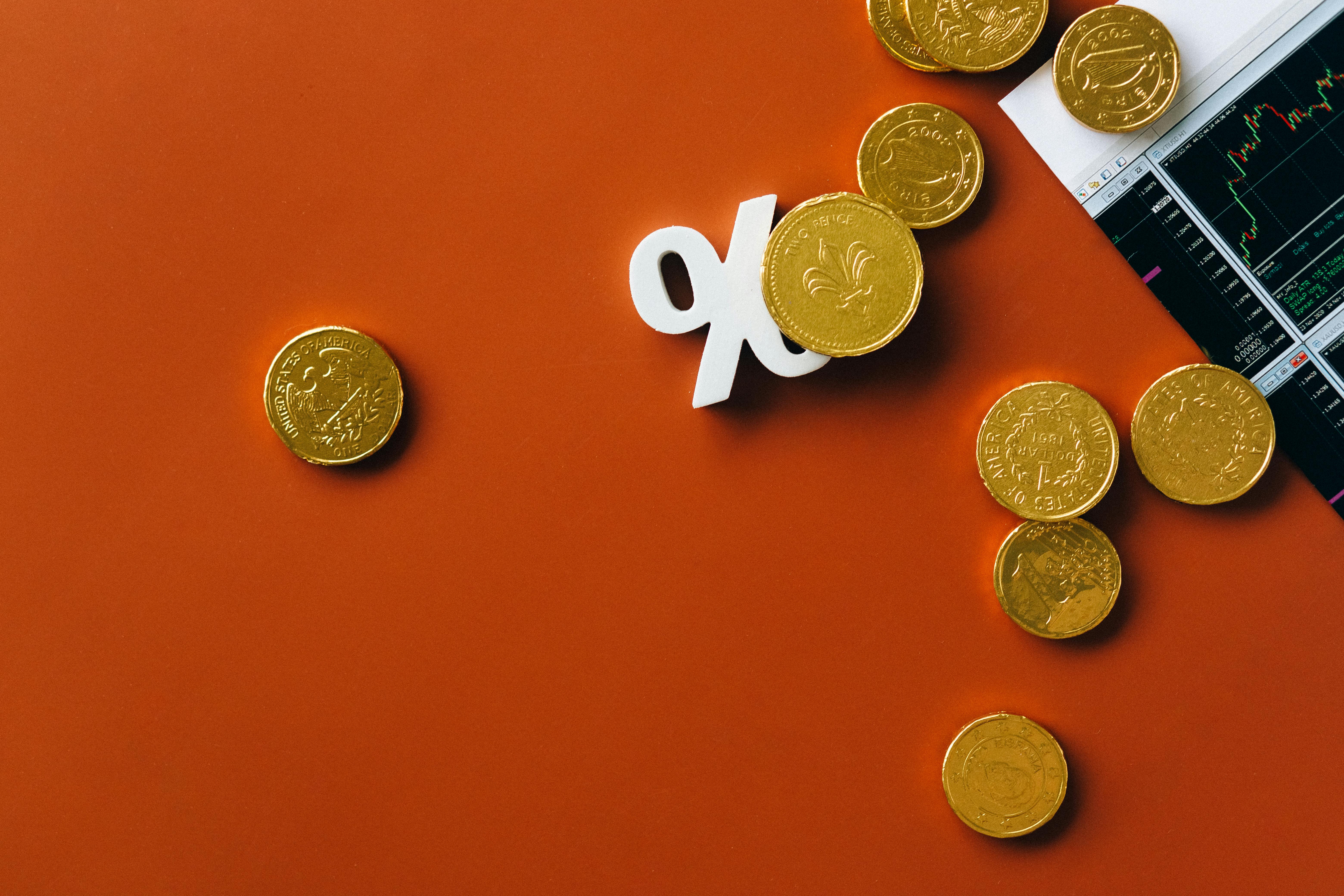 gold coins on orange background