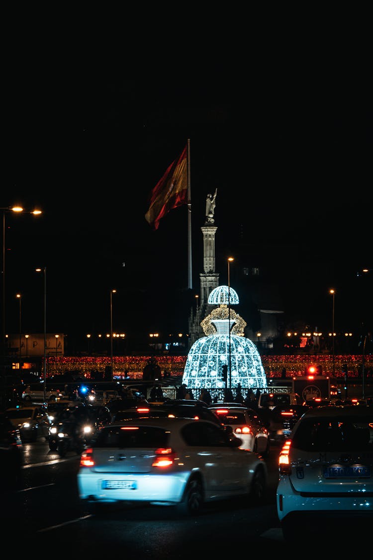 Cars On Road At Night Along Plaza De Colon In Madrid