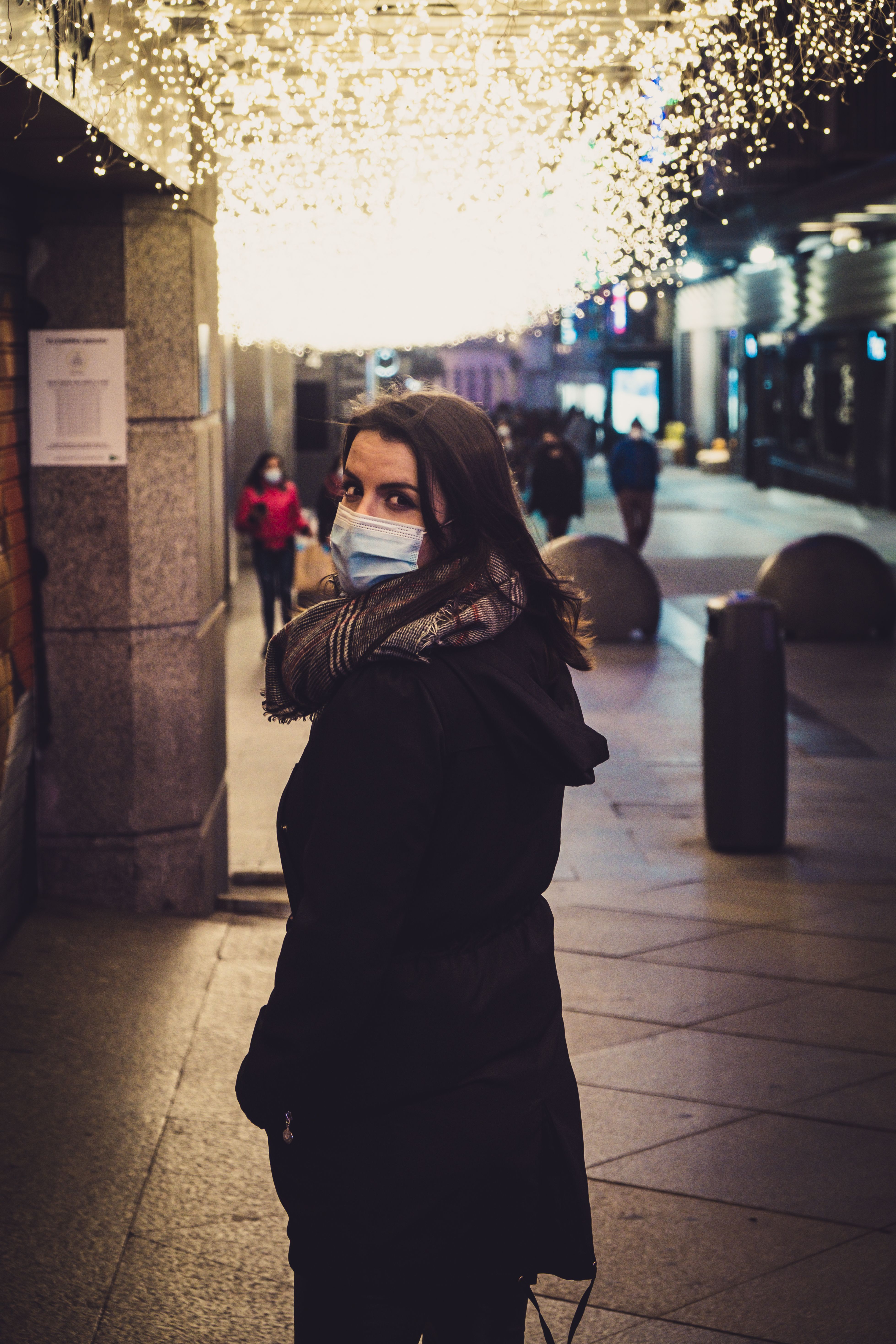 Woman in Black Coat Looking Back · Free Stock Photo