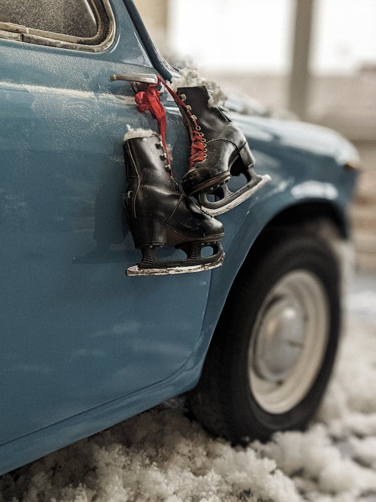 Ice Skate Hanging On A Car Door Handle