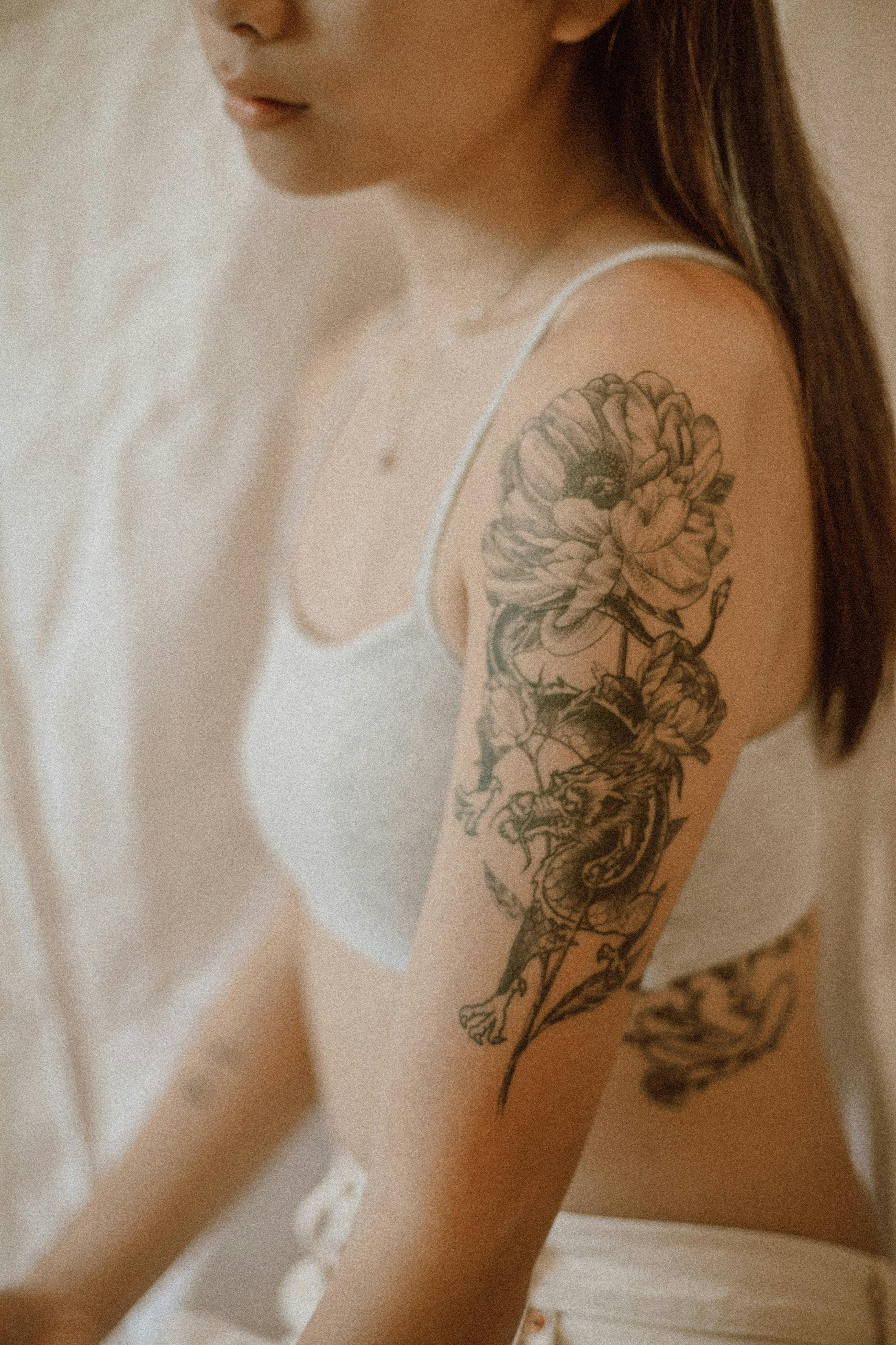 Woman in Red and Gold Floral Dress With Black Floral Tattoo on Her Left  Hand  Free Stock Photo
