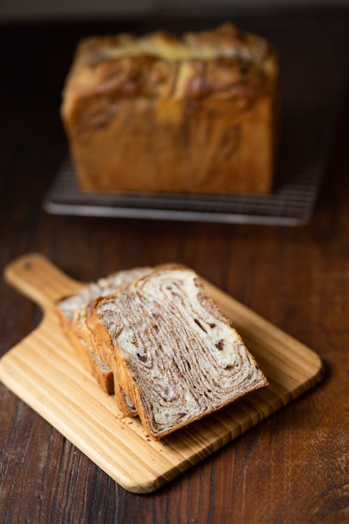 Free Sliced Cinnamon Bread on a Wooden Chopping Board Stock Photo