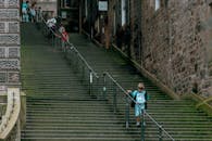 Metal Handrails on Green Stairway