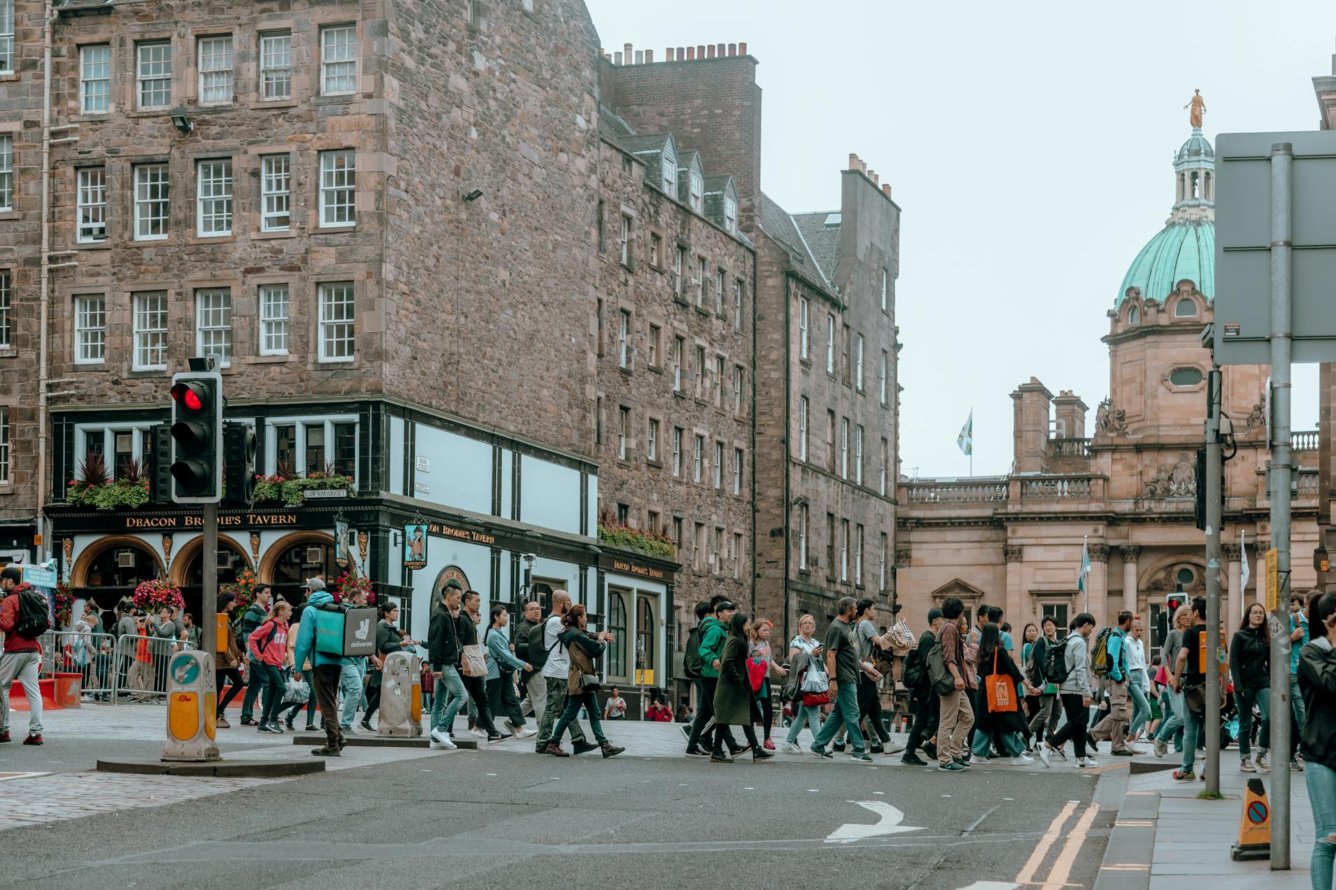 People Crossing Street Near the Deacon Brodies Travern