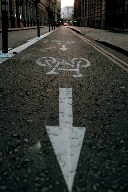 White Arrow Signs on Bicycle Lane