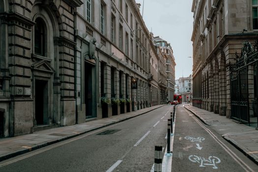 Quiet urban street view with bicycle lane and classic architecture.