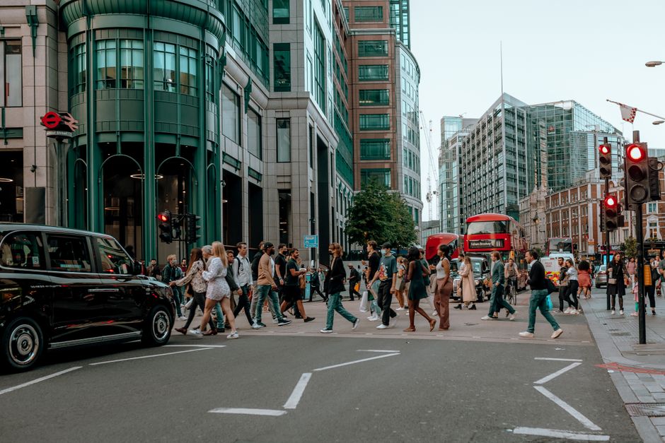 diverse commuters crossing road London
