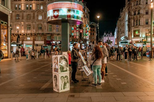 People in a City at Night