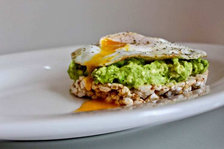 Fried Egg And Lettuce On Rice Wafer