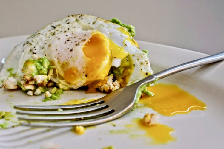 Avocado With Fried Egg With Runny Yolk 