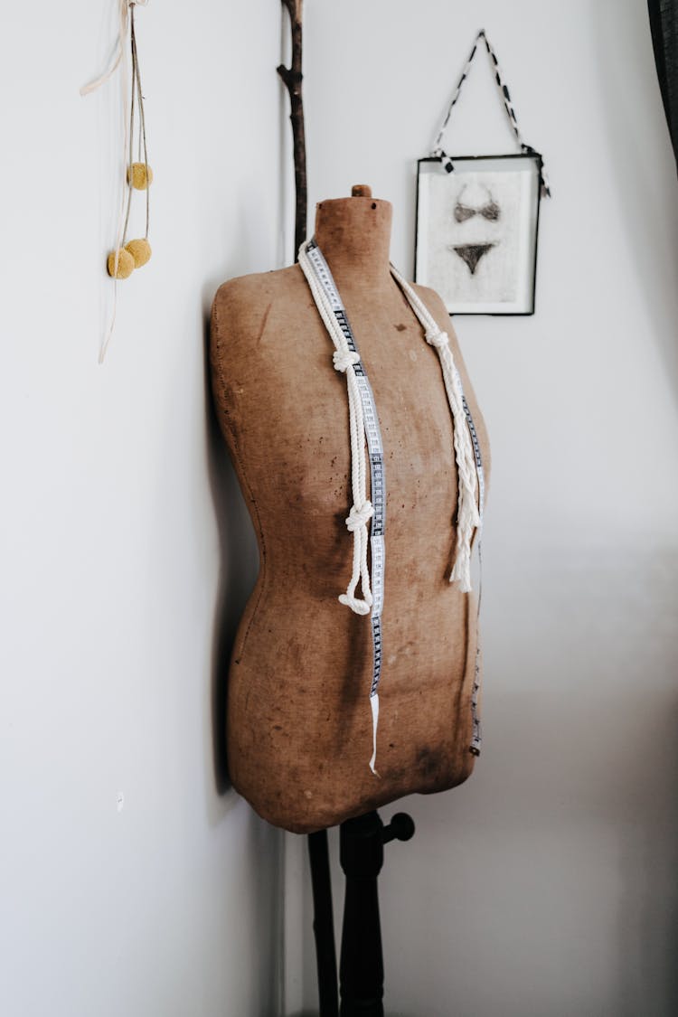 Brown Half Body Mannequin With Measuring Tape And White Rope