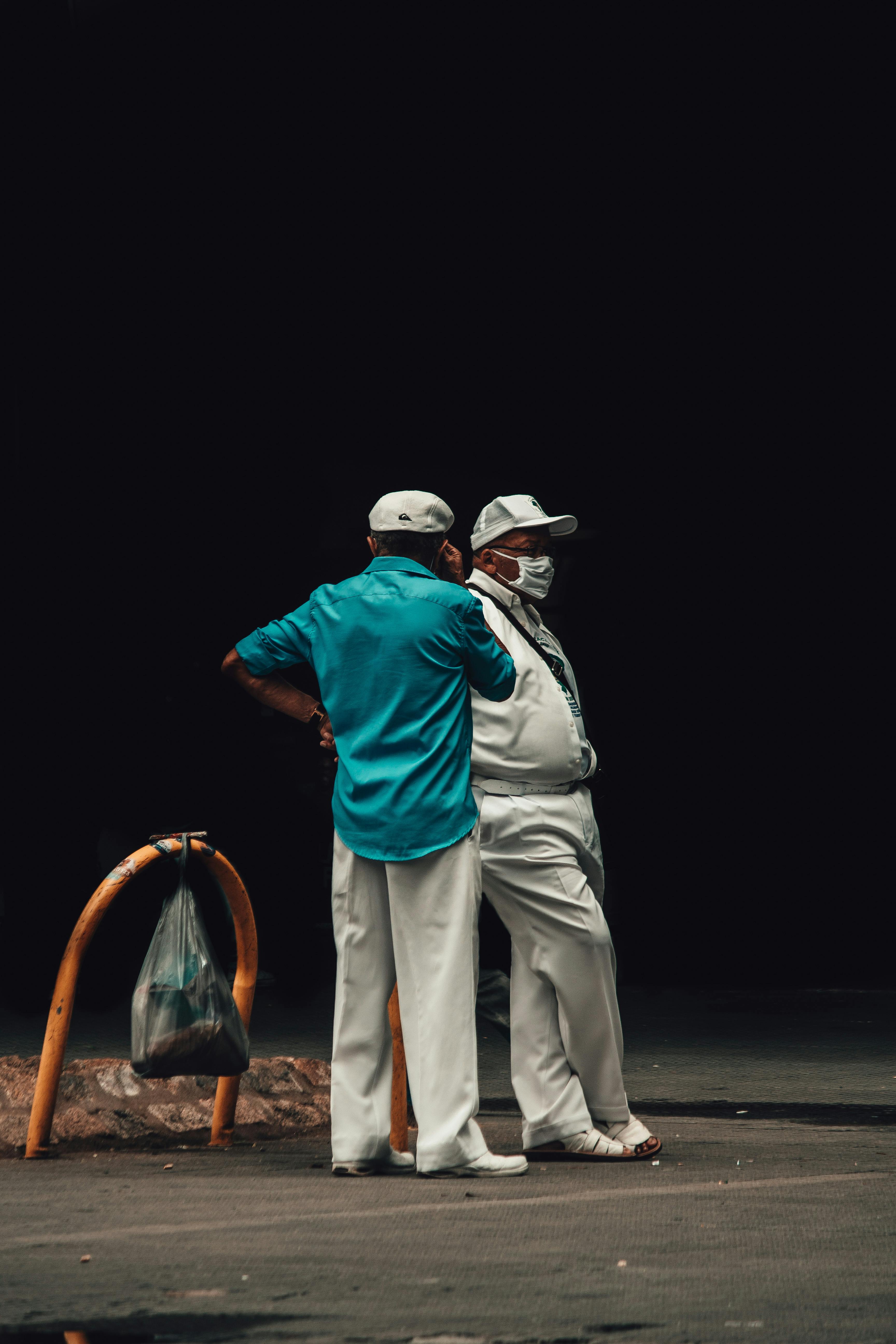 people standing on city street