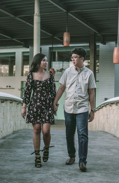 Free A young couple walking hand in hand, showcasing romance and connection. Stock Photo