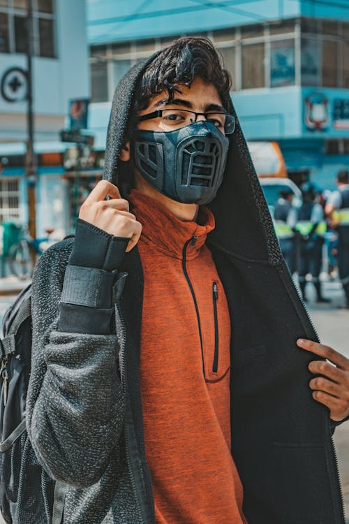 Man in Black Hoodie Wearing Black Mask